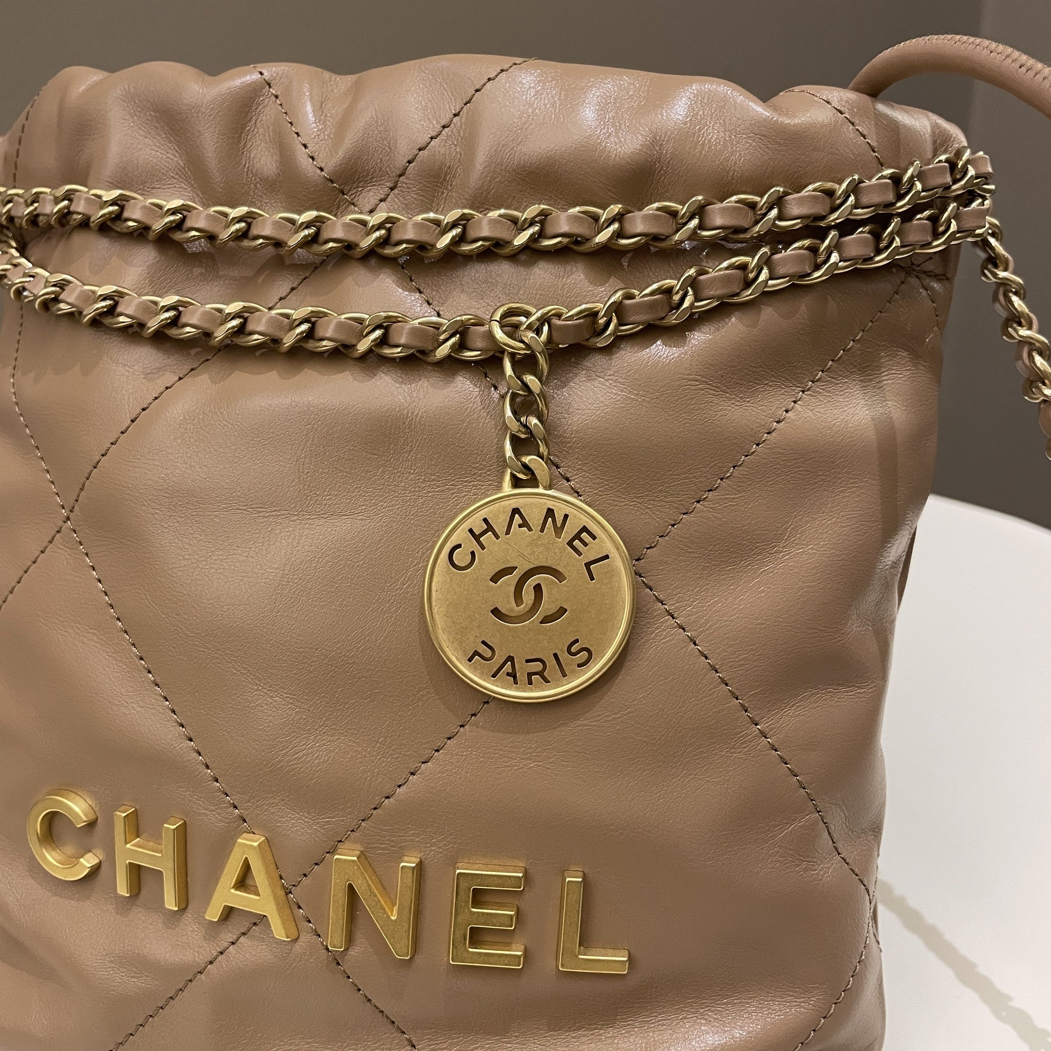 Chanel 23B 22 Mini Hobo Beige Calfskin