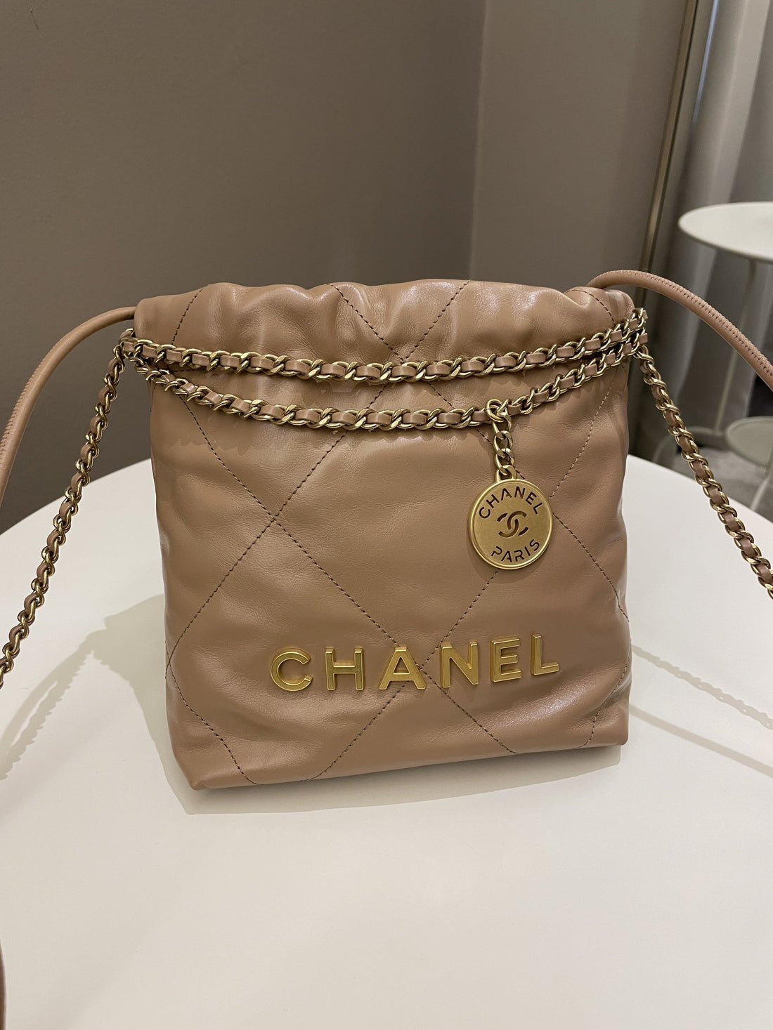 Chanel 23B 22 Mini Hobo Beige Calfskin