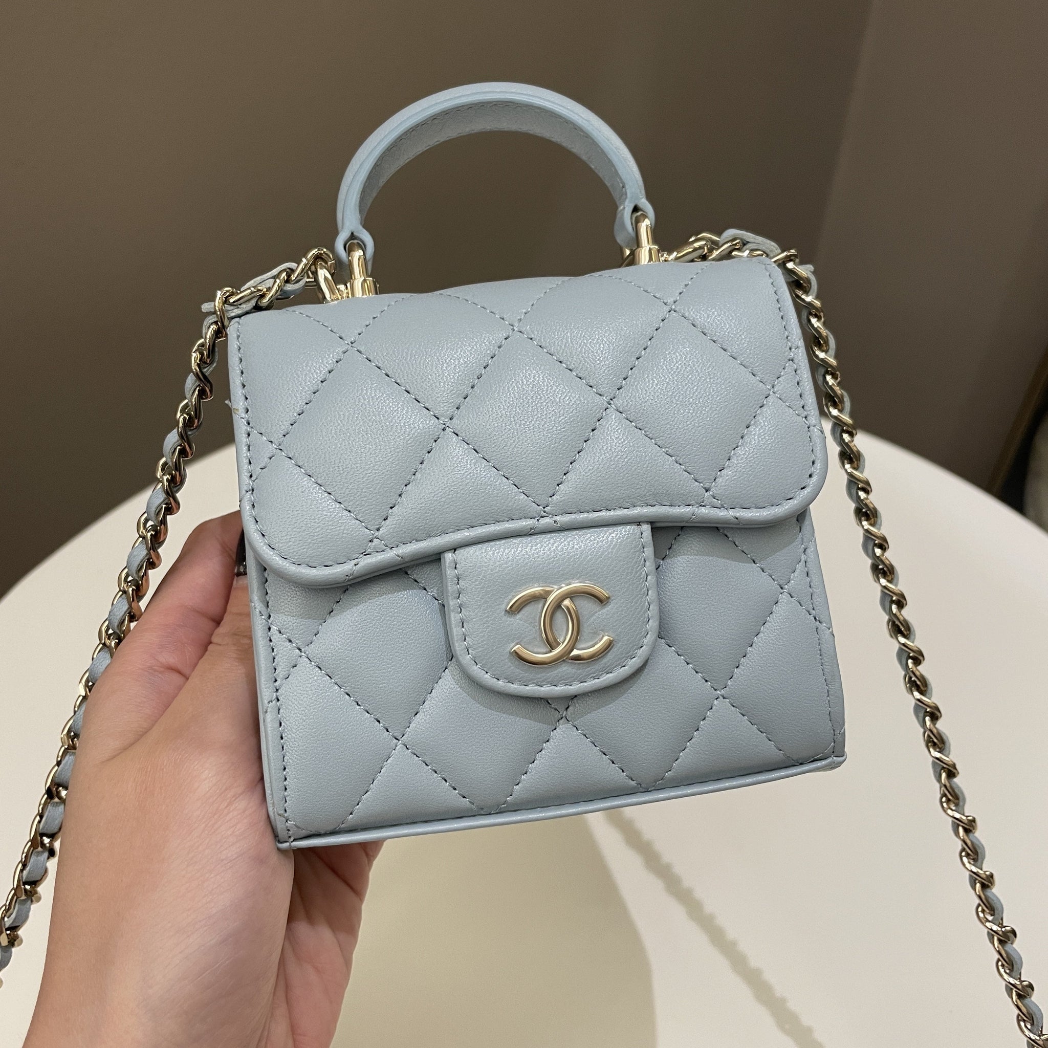 Chanel 22P Top Handle Clutch On Chain Baby Blue Lambskin