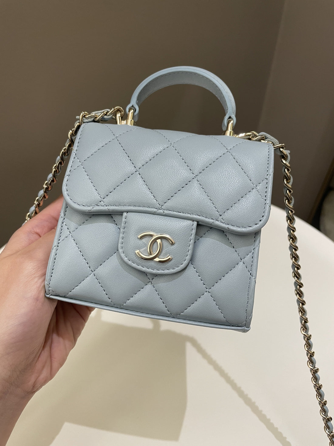 Chanel 22P Top Handle Clutch On Chain Baby Blue Lambskin