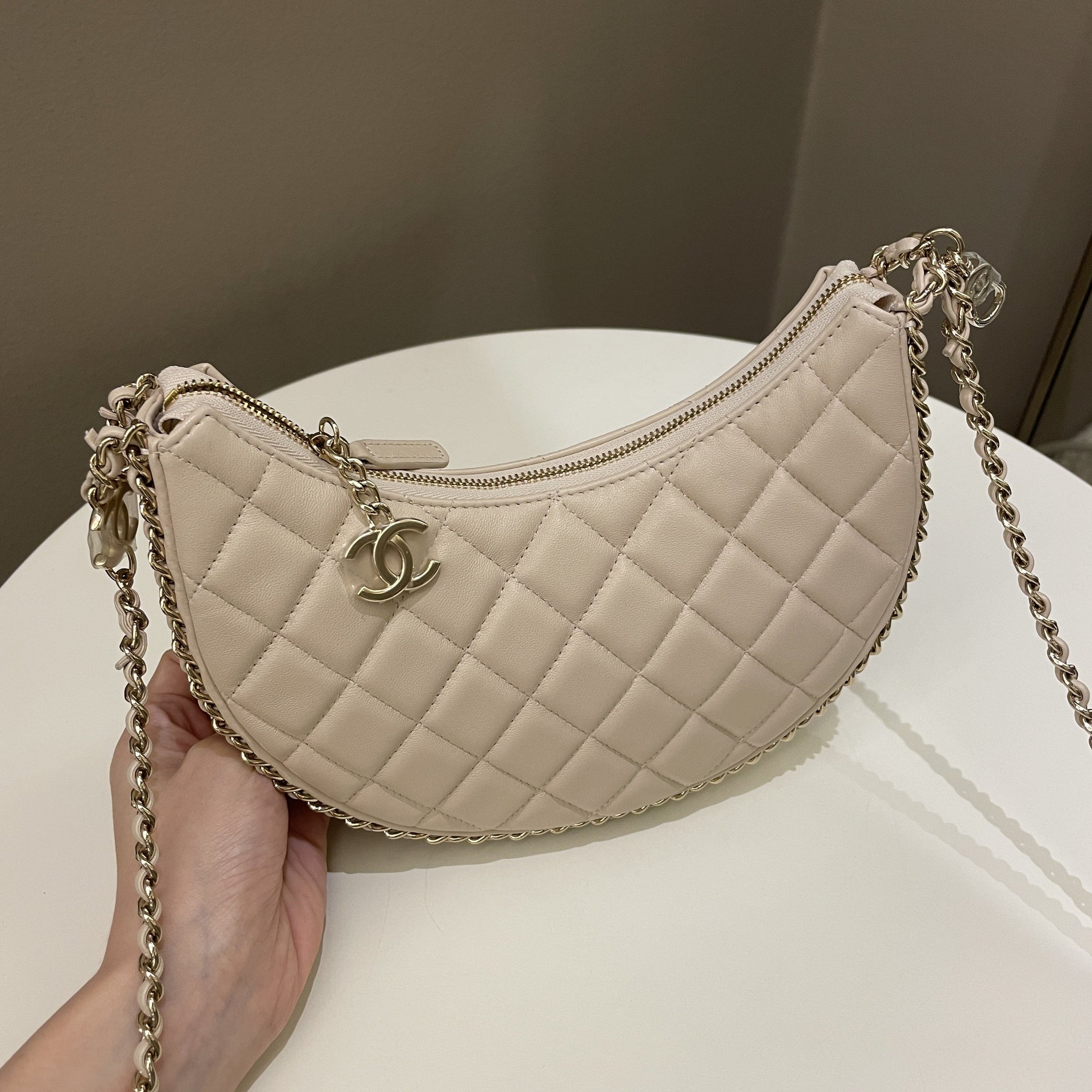 Chanel 23P Quilted Chain Around Hobo Bag Beige Lambskin